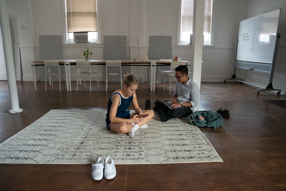 Halie and Norton sitting on a new (to us) rug.