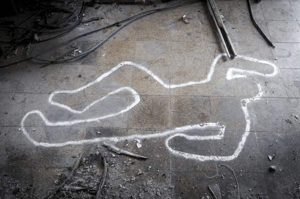 the chalk outline of a murder victim on the floor of a mine... no it's not a modern day warehouse, it's a mine, a mine in 1870s New Mexico, so there.
