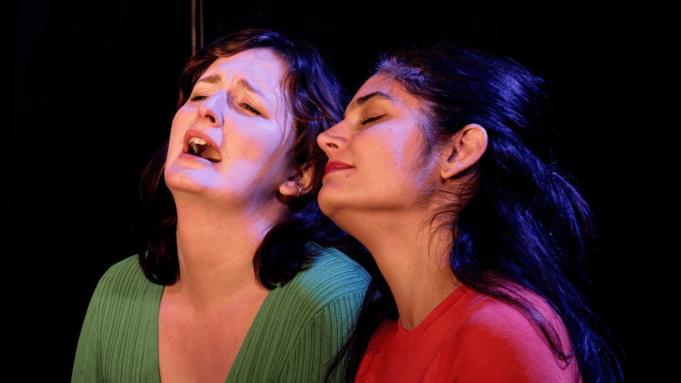Two actors (Mash and Tanine) in close up, closing their eyes and connecting in a scene