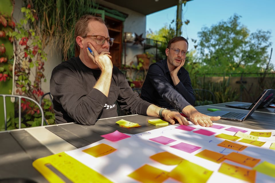 Ben and Jesse with post-its, planning