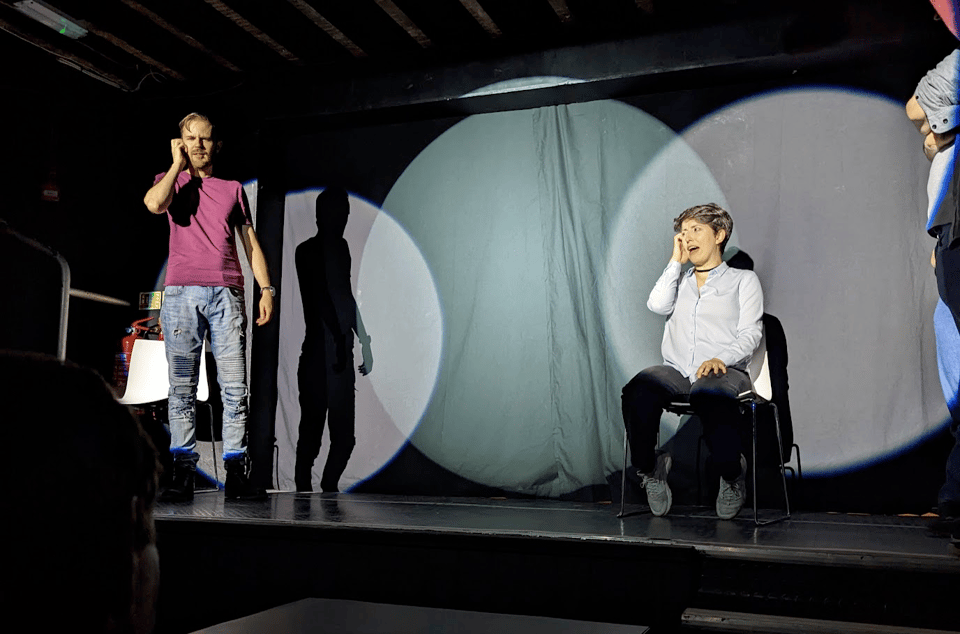 to actors improvising on a stage