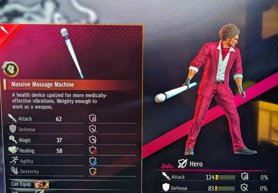 A screenshot of a video game where a man's weapon is an very large, Hitachi-like massager.