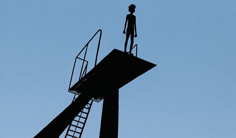The silhouette of a boy on a springboard from the cover of a graphic nover