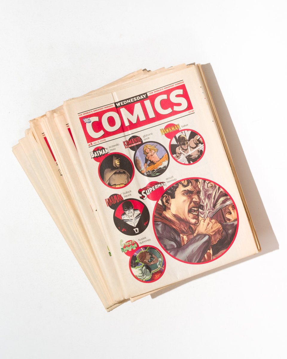 a stack of the complete run of Wednesday Comics