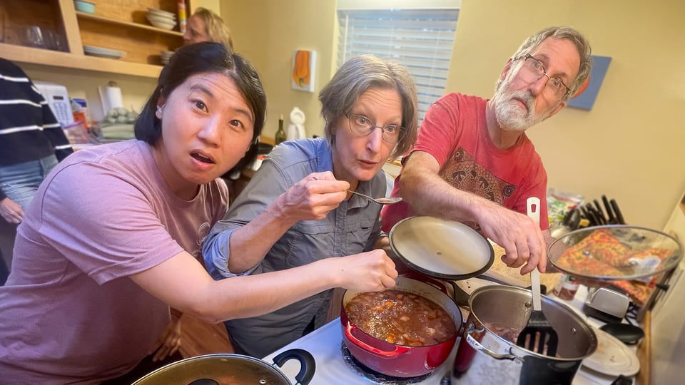Alice, Kinnabari, and Deprong Mori prepping dinner