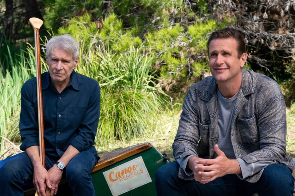 Image from the season 2 of Shrinking. Harrison Ford and Jason Segel sit on a boat.