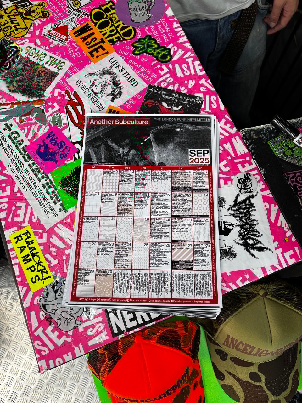 A fresh pile of Another Subculture zines on the shopfront of WASTE!