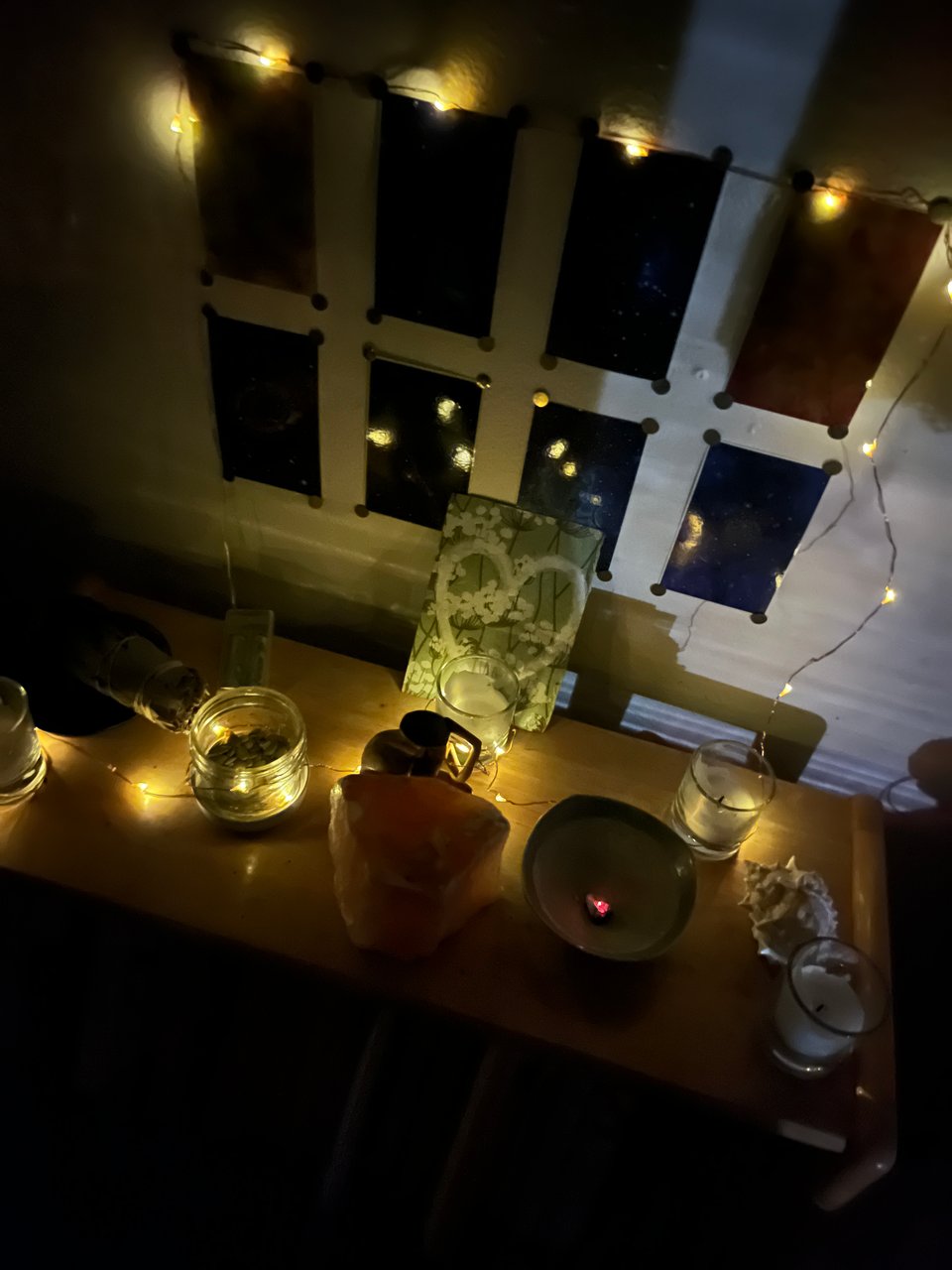 Candlemas altar in the dark lit with fairy lights