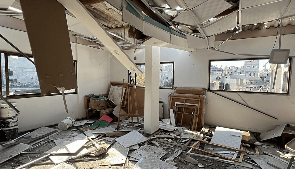 a photo of an art studio inside a building destroyed by bombing