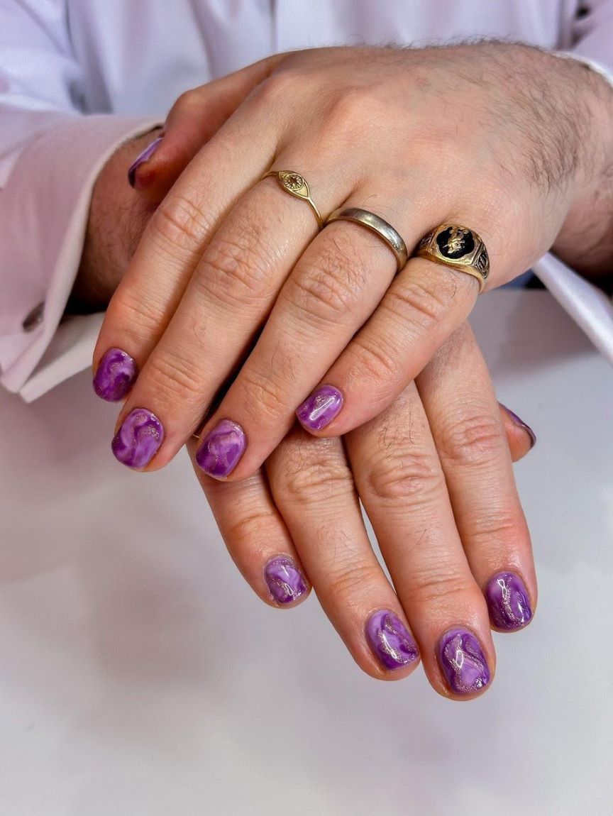 A purple marble manicure.