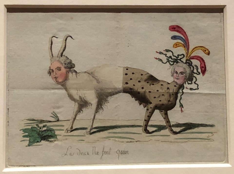 A rectangular print of a two-headed, four-legged, goat-like mammal, with heads of a man and a woman, looking at each other. The man’s half of the body is white; the woman’s half is brown with black spots. The woman's head has snakes and ostrich-like feathers coming out of it.