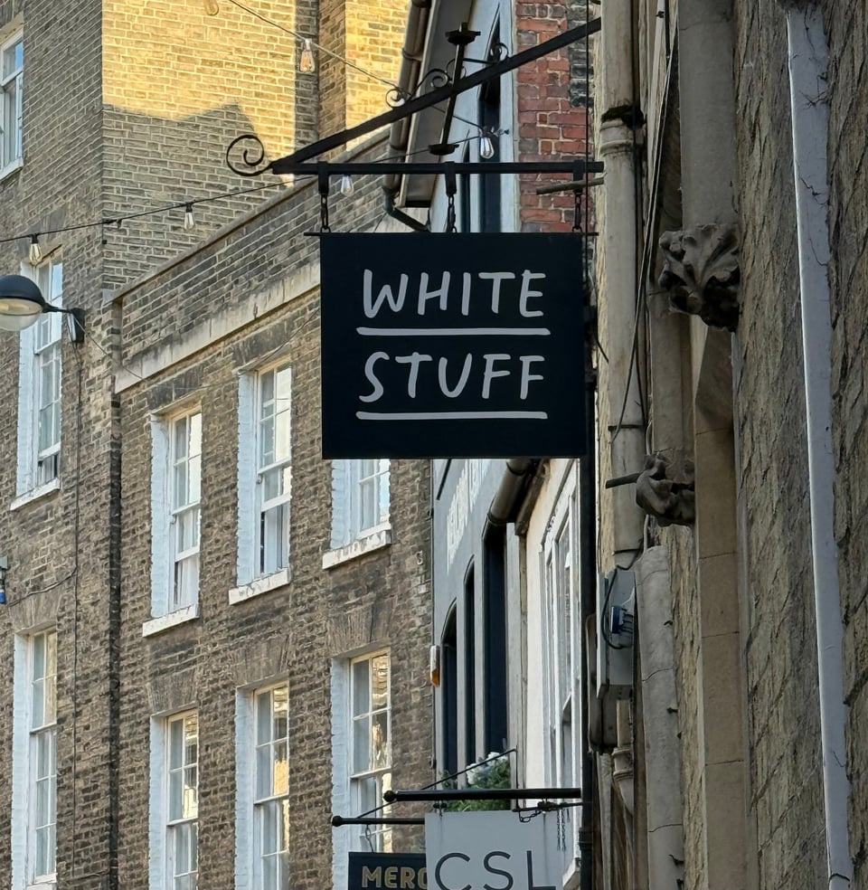 photo of store shingle-sign in Cambridge, UK, reading WHITE STUFF
