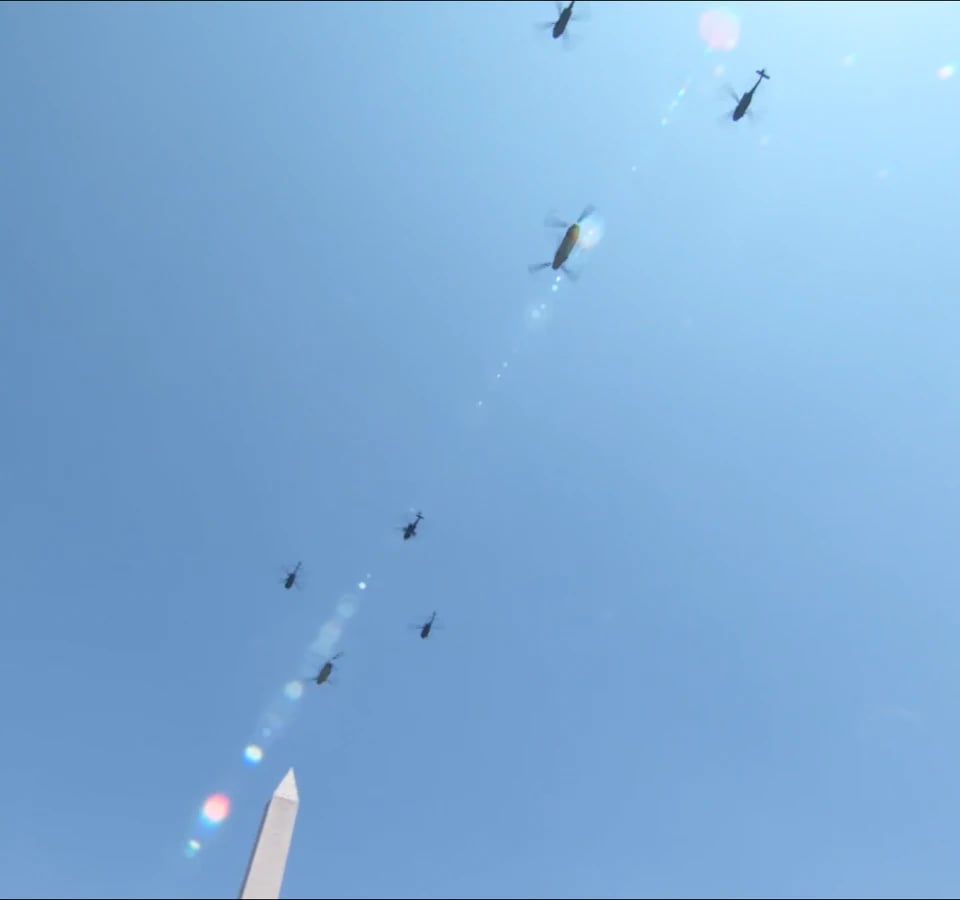 Screen capture from America 250 Air Show over Washington D.C. showing helicoper review passing over the Washington Monument.