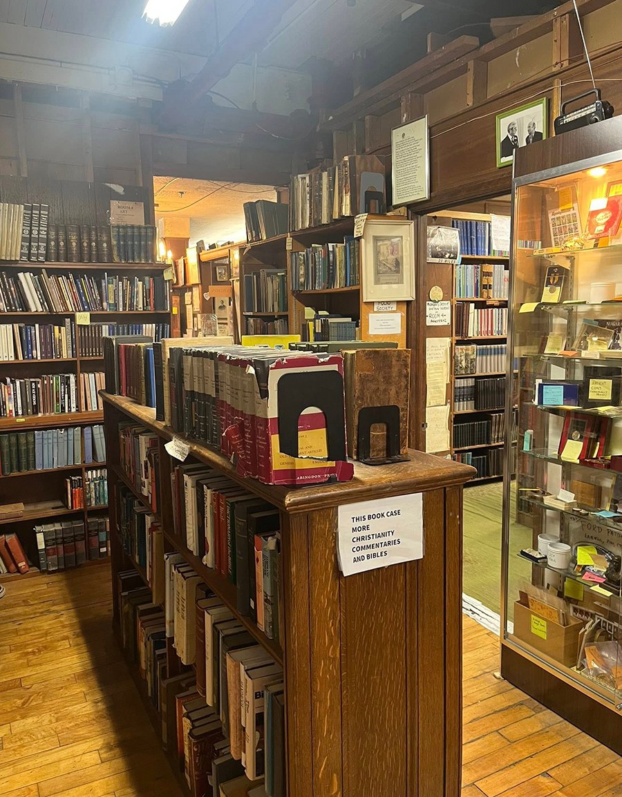 This picture of a random spot in the first floor features lots of shelves with lots of books.