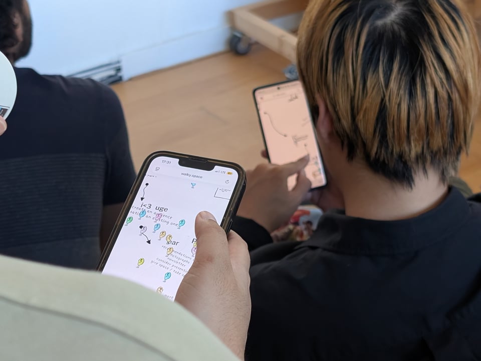 People on their phones, playing a cute multiplayer game. One character in the game says "i love UGE"