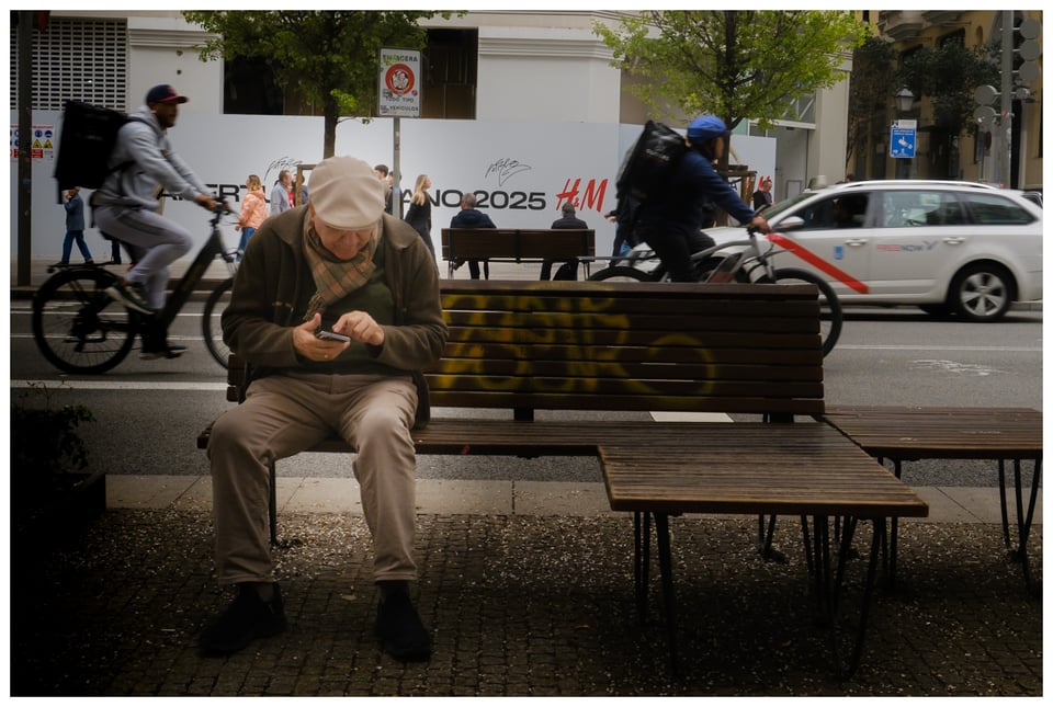 a man sitting on a bench