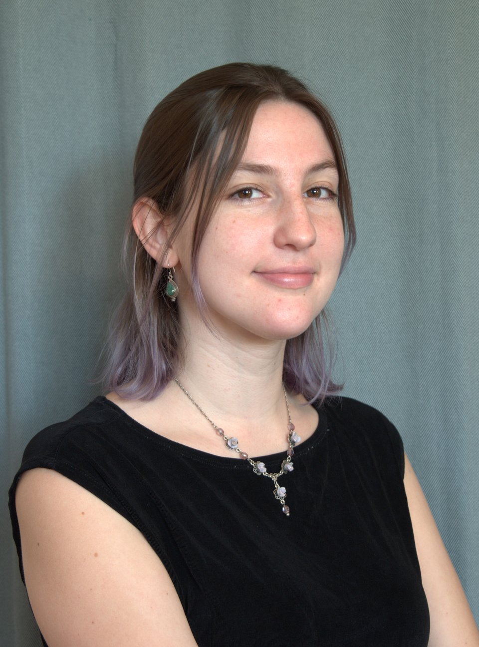A young woman posing for a professional photo.