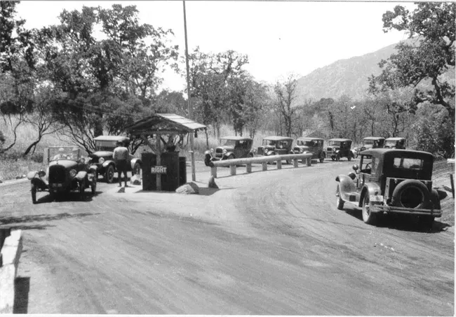 Model Ts lined up at a national park entrance hut