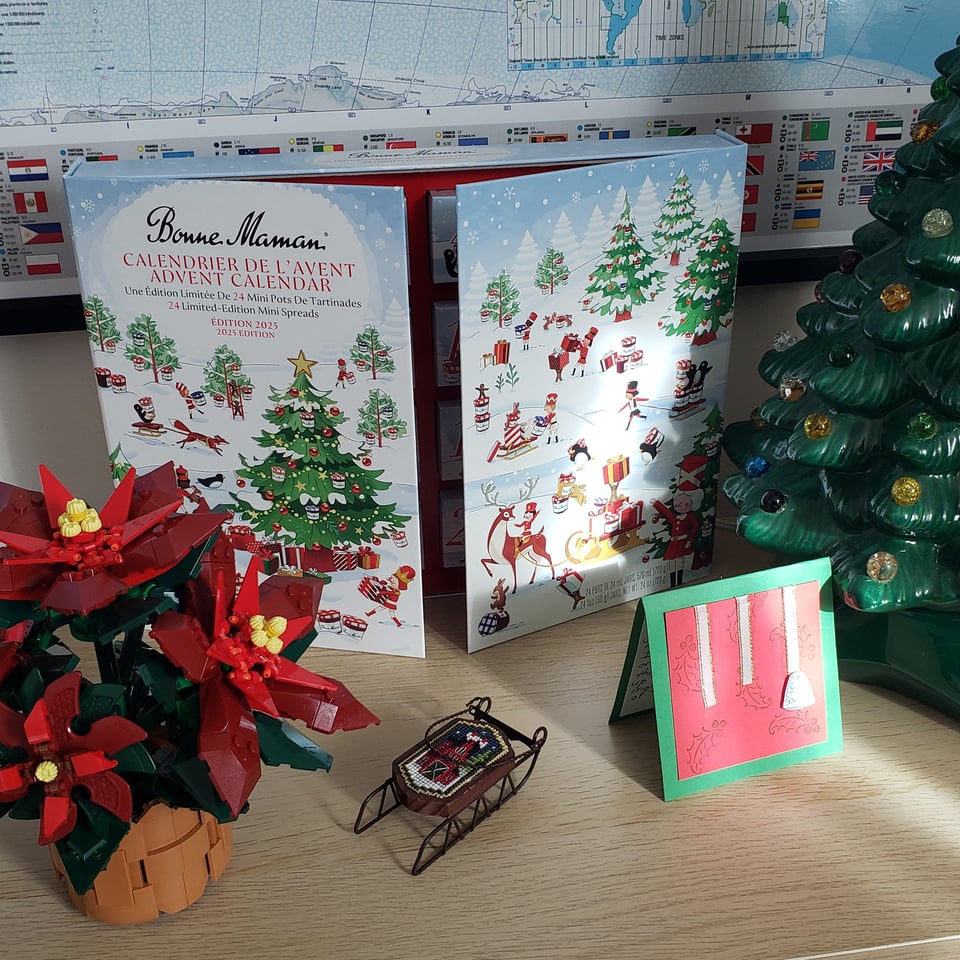 the bonne maman jam advent calendar with a lego poinsettia and a tiny sleigh