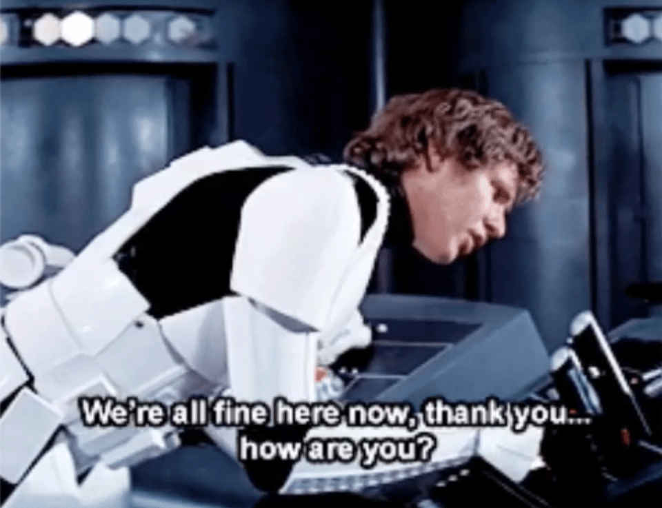 Hans Solo in a stormtrooper outfit saying into a desk-sized intercom, "We're all fine here now, thank you... how are you?"