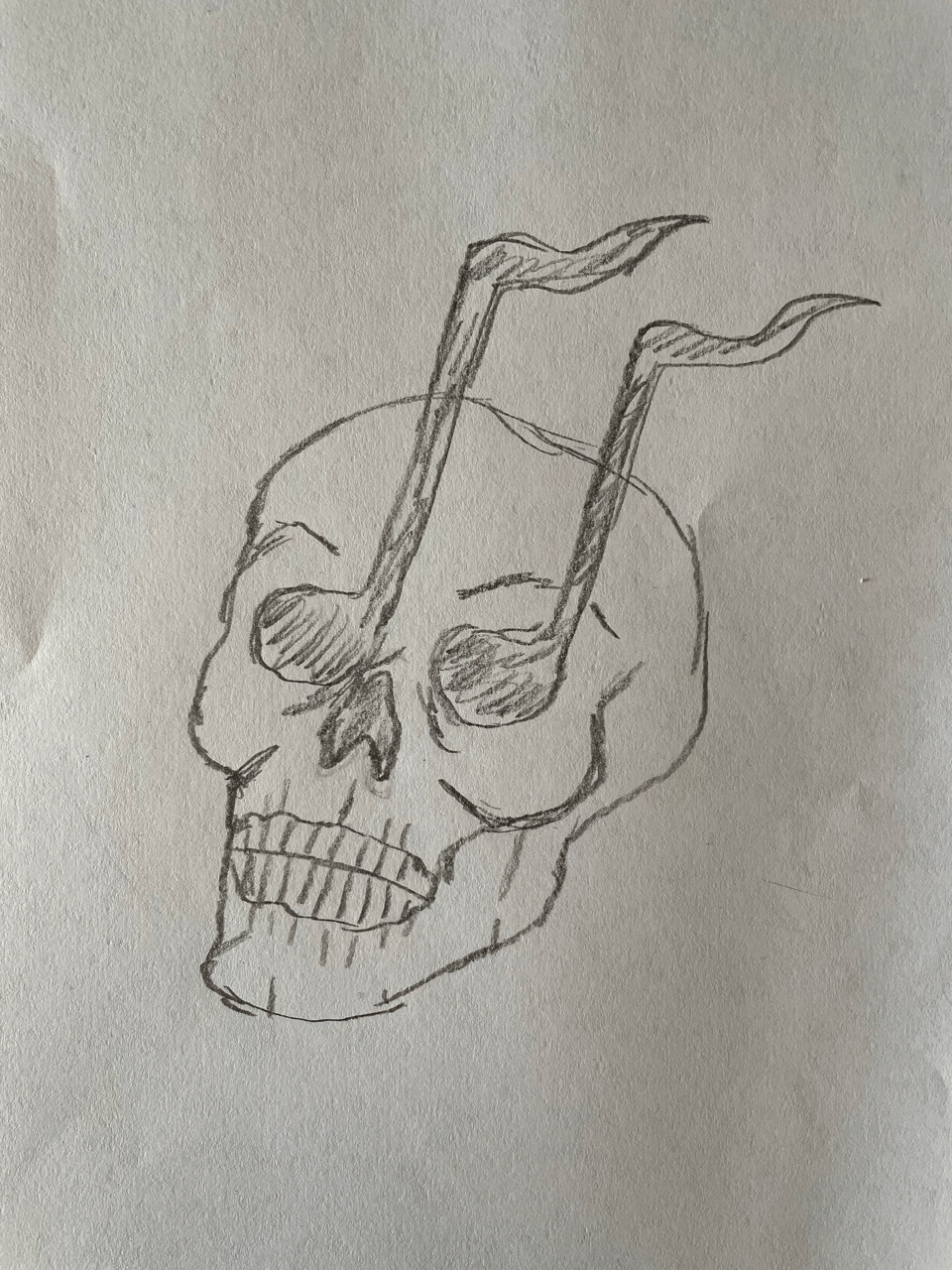 A rough pencil sketch of a skull head with music notes for eyes