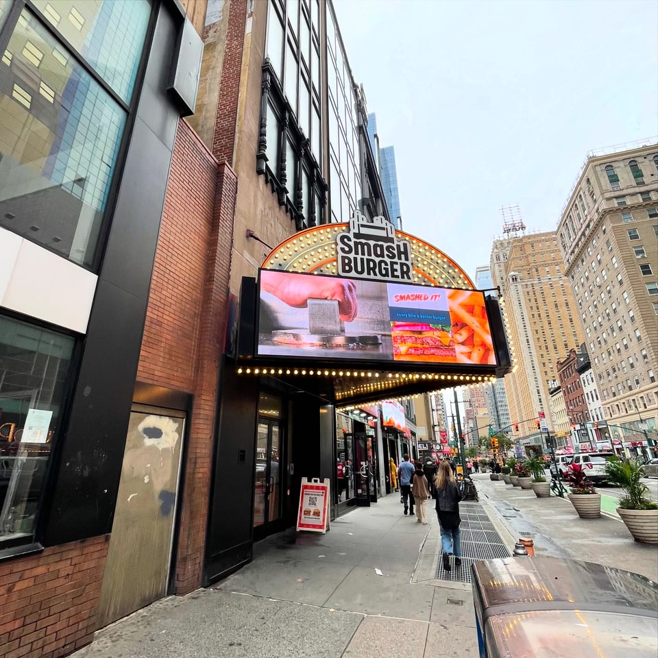 The former Show World marquee, now advertising Smash Burgers.