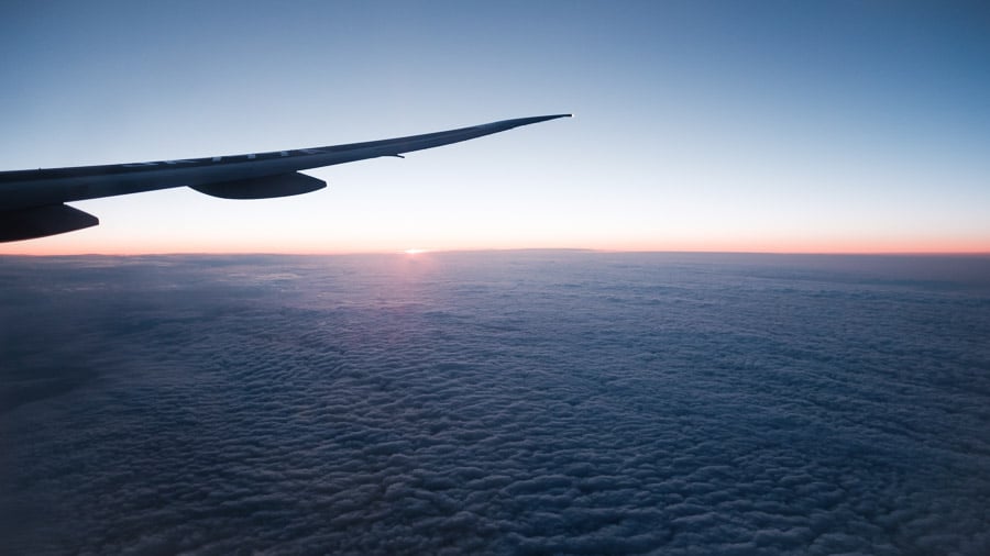 01 - Plane wing above clouds