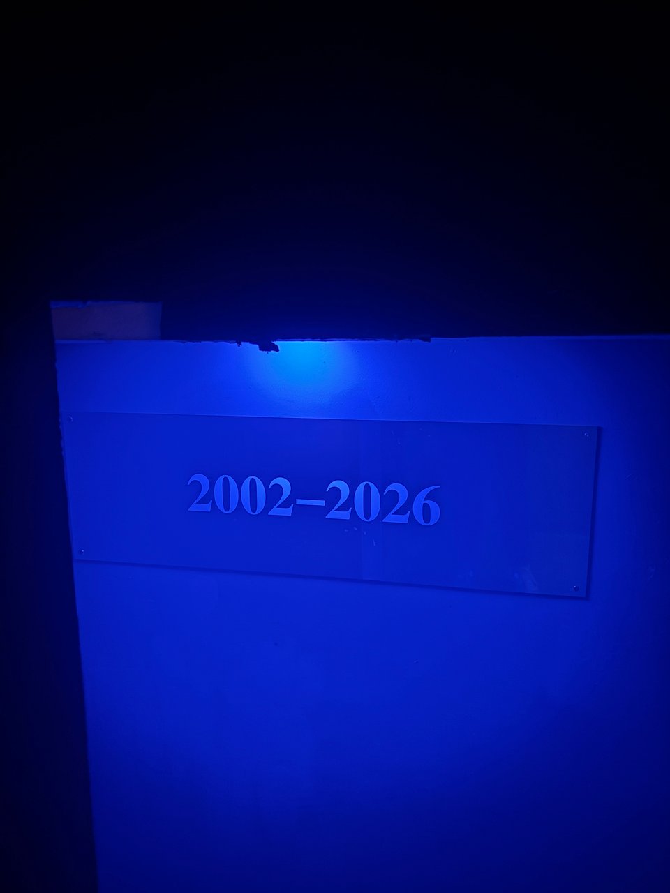 a sign with '2002-2026' on it