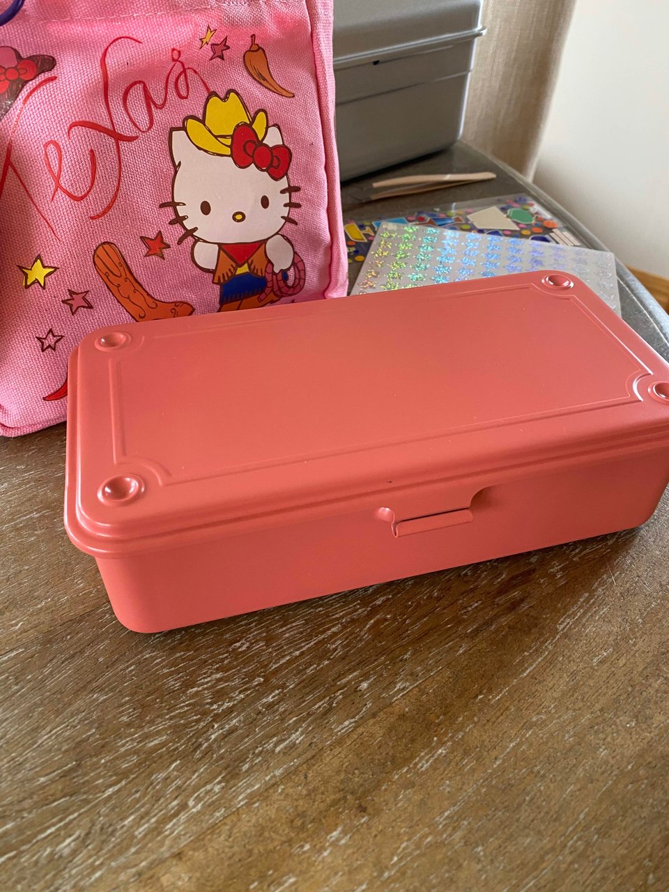 a coral box on a wood table surface