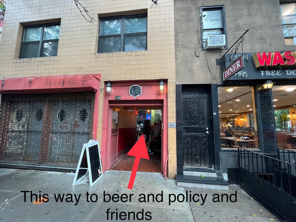 storefront and arrow indicating where the happy hour location