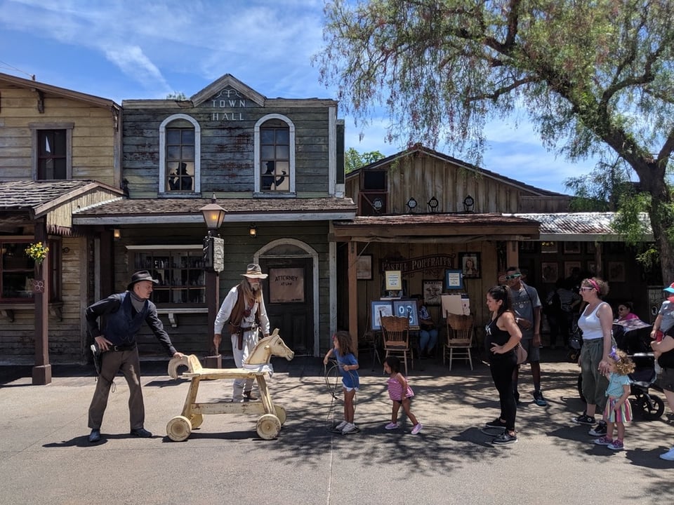 Cowboys and Theme Park Guests in the town of Calico at Knott's Berry Farm.