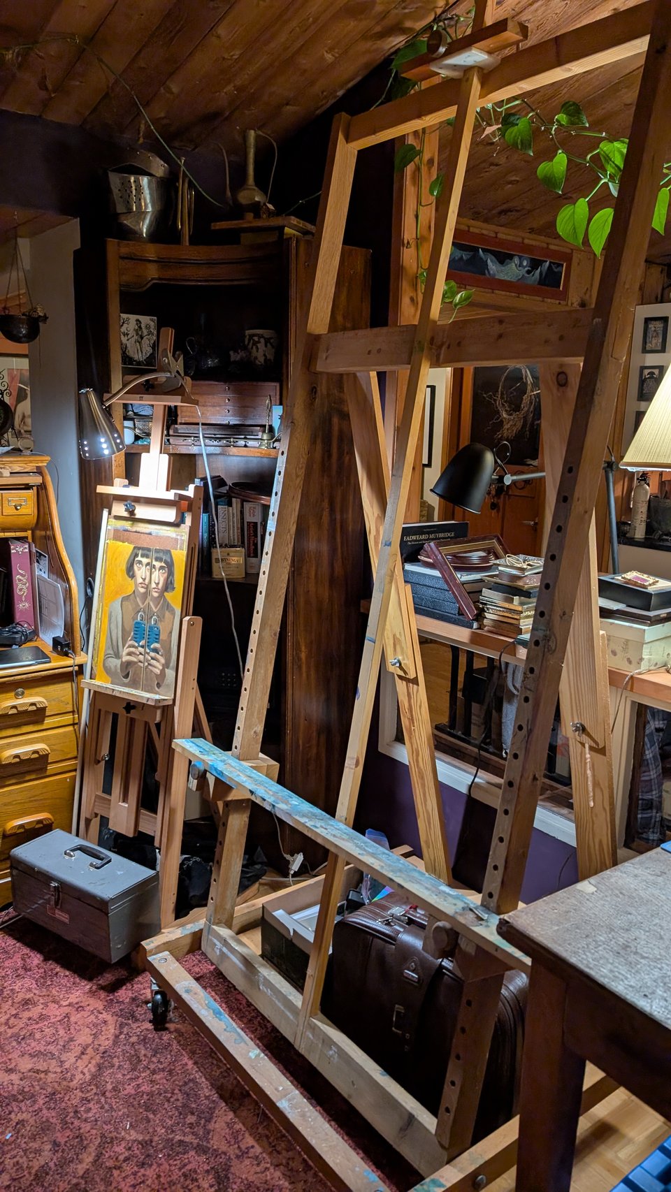 A photograph of the large easel next to the small easel. The large easel is easily 5 times bigger.