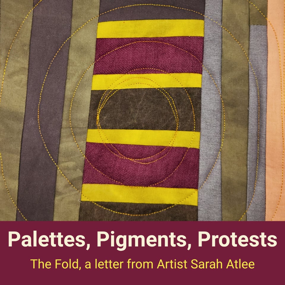 Title card for this edition of The Fold newsletter. Photo is of a small patchwork quilt by Sarah Atlee made of cotton and wool dyed with natural pigments.