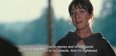A screenshot of a scene from Pride and Prejudice (2005). Charlotte Lucas is to the left of the image, with the sun at her back. She wears a dark shawl over her dress. We do not see who she is speaking to. The subtitles read: "I’m 27 years old. I’ve no money and no prospects. I’m already a burden to my parents. And I’m frightened."