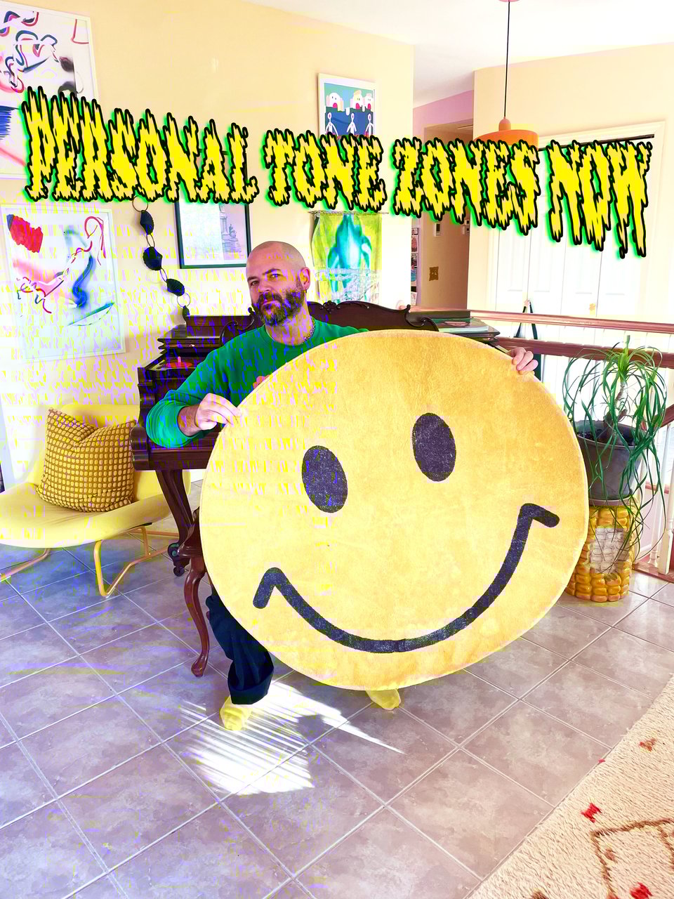 a man in a crewneck sweater holds up a smiley face rug and offers "Personal Tone Zones Now"