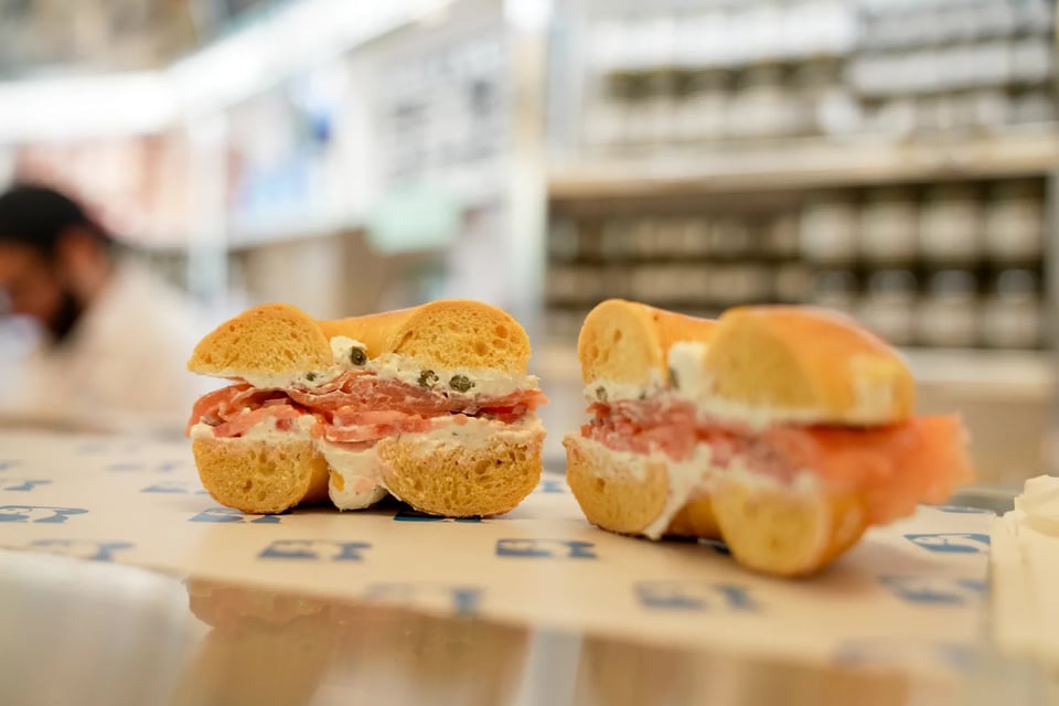The iconic lox bagel — a "Classic with the Works" — prepared at Russ & Daughters.