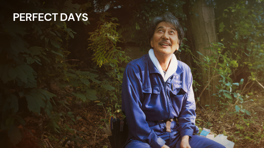 a poster for the film, Perfect Days. it features a man in blue overalls in a wooded environment, looking upwards and smiling
