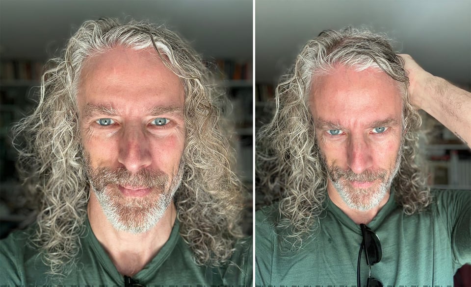 two photos of a white man with long hair and a bear that's going white; he's in a green pullover and the natural light on his face is fantastic; in the right picture, his left hand is up, pulling his hair back a little; he's got sunglasses hanging from his collar