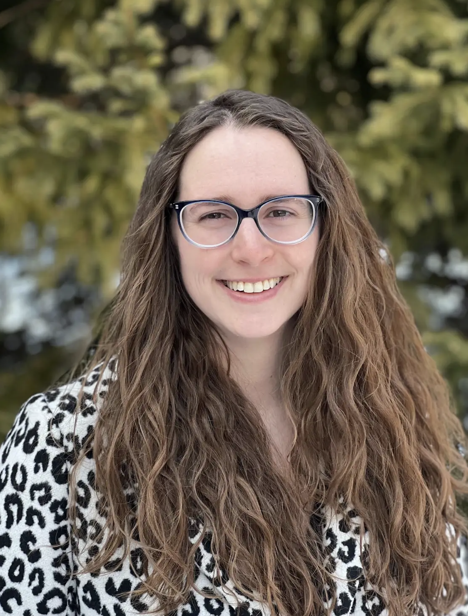 Abigail McCarthy wearing glasses and a leopard print jacket