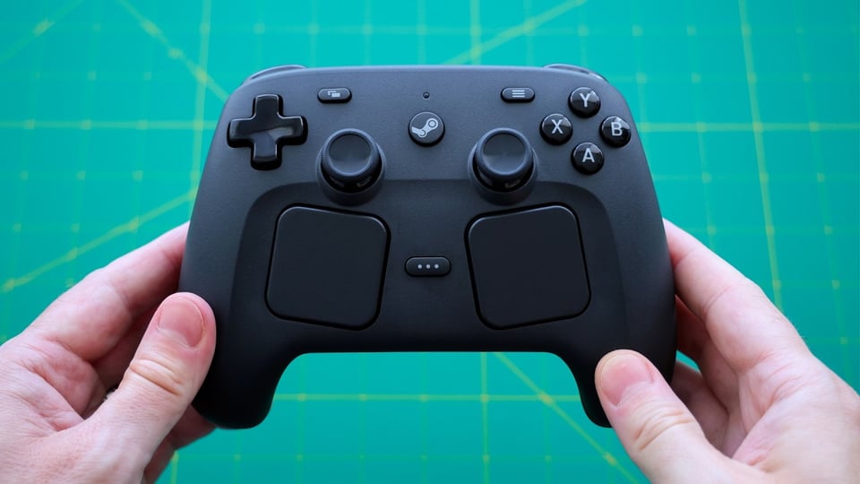 Steam controller held in my delicate hands