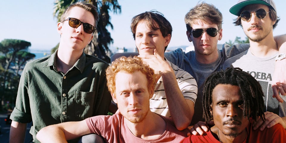 The John Wizards band pose in the sunshine.
