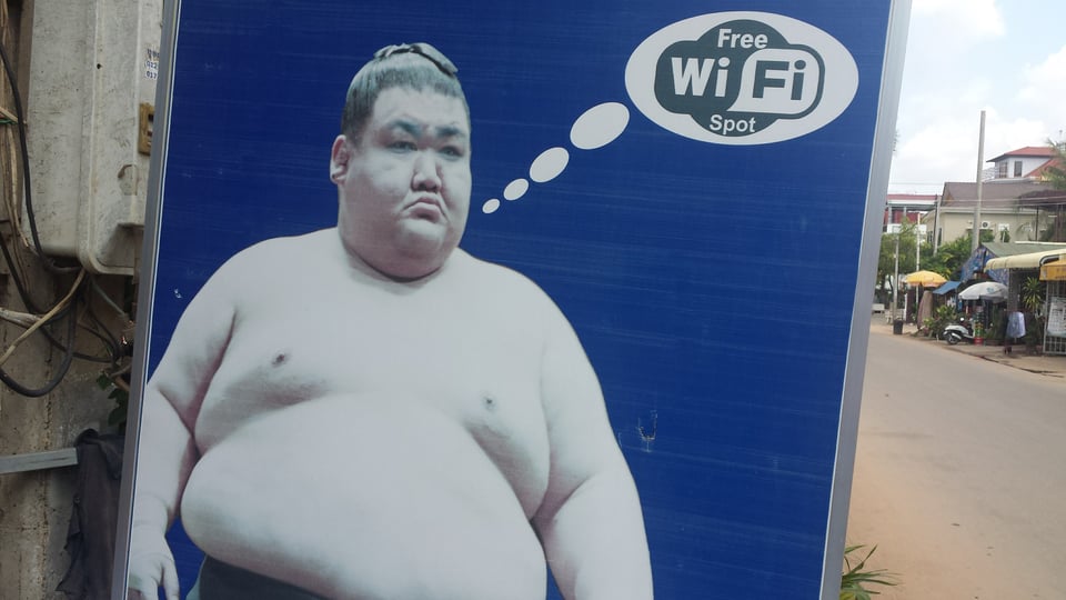 Outdoor ad somewhere in Asia: A sumo wrestler thinking "FREE WIFI SPOT"