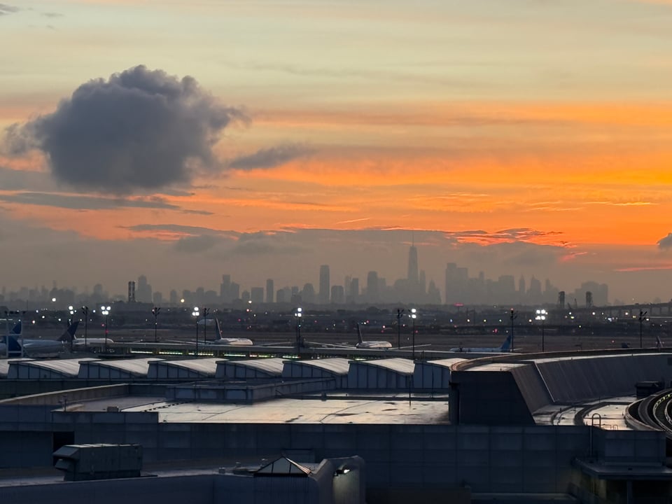 Photo from Newark Airport parking garage with spectral & hazy NYC skyline in the early morning background