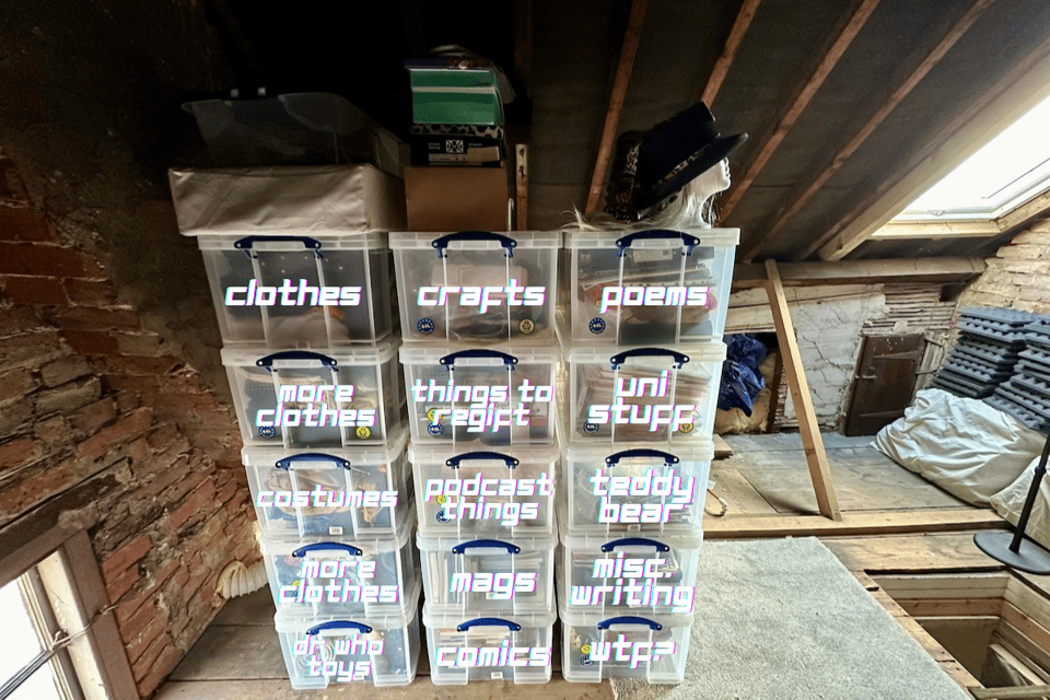 A stack of clear plastic crates with stuff in them.