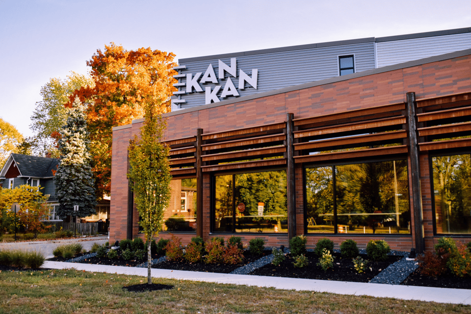 This is an image of the kan-kan cinema building in Windsor park. It shows a brick building with built in windows and then further up a sign that says Kan-Kan along a plastic sided facade.
