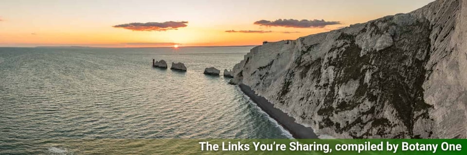 A view of the Needles, narrow cliffs, leading out to sea and the sunset.