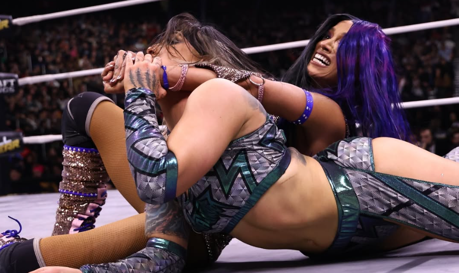 Mercedes Mone holds Kris Statlander in a crossface.