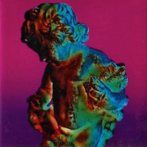 A color photo of a statue, some kind of cherubic figure, holding some kind of plants, leaves, I think. The lighting on it colors it from dark red to green to blue. The upper part of the background is dark pink, and that turns into dark purple by the bottom.