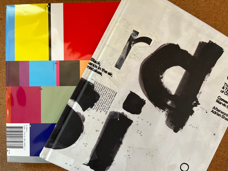 Shot of the books Disorder and Wipeout:Futurism on a cork background