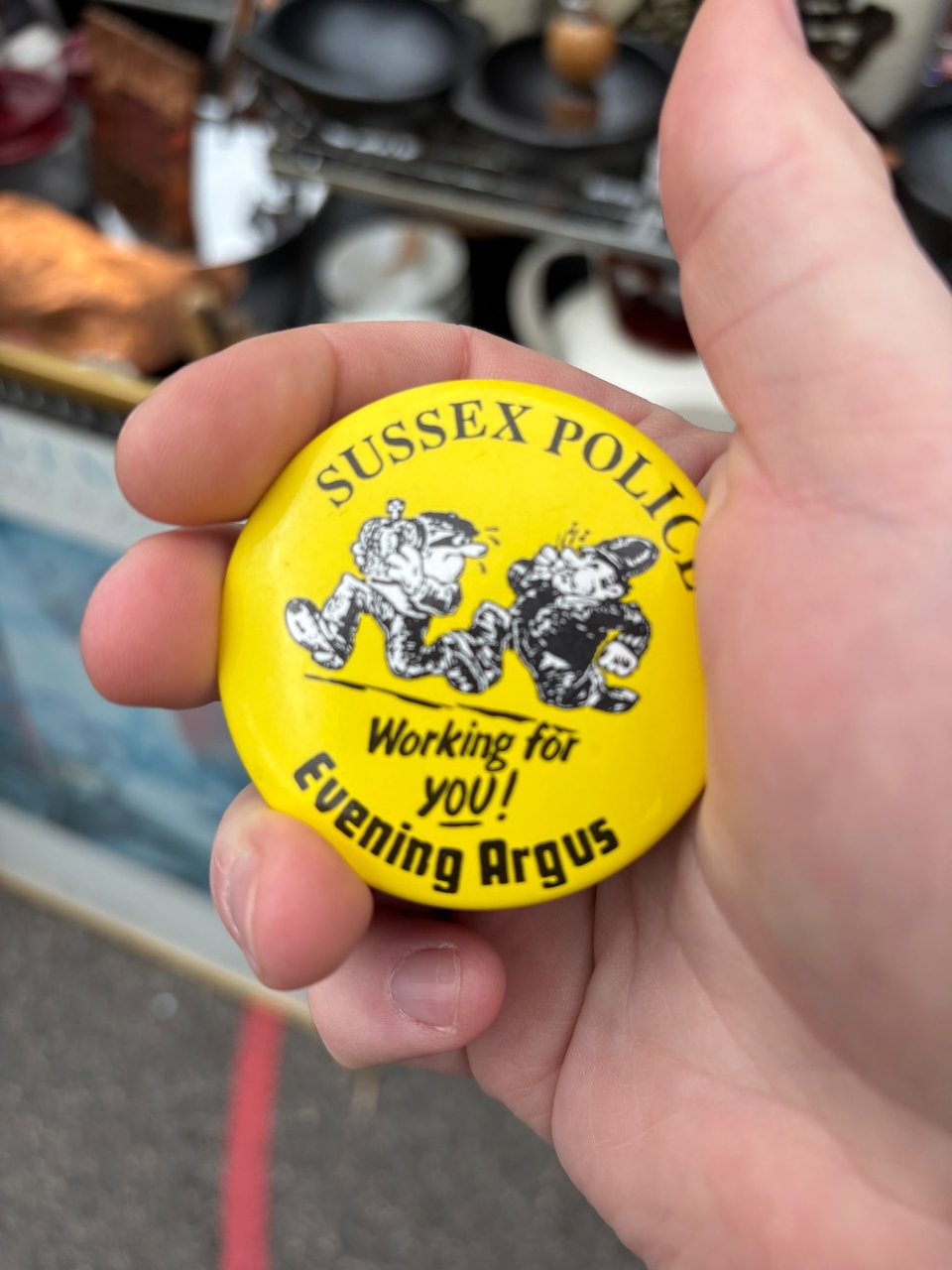 I am holding a badge with the Repetitive Strain logo. It's by Sussex Police... what's going on there now